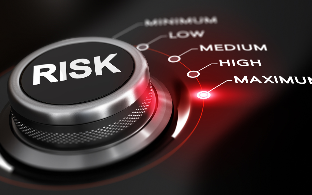 In the center of the image is a circular button with the word “RISK” across its middle to emphasize the accompanying content life insurance quote comparisons. Along the button’s right curve are the words minimum, low, medium, high and maximum, each word with a dot next to it. The dot next to the word maximum is glowing.