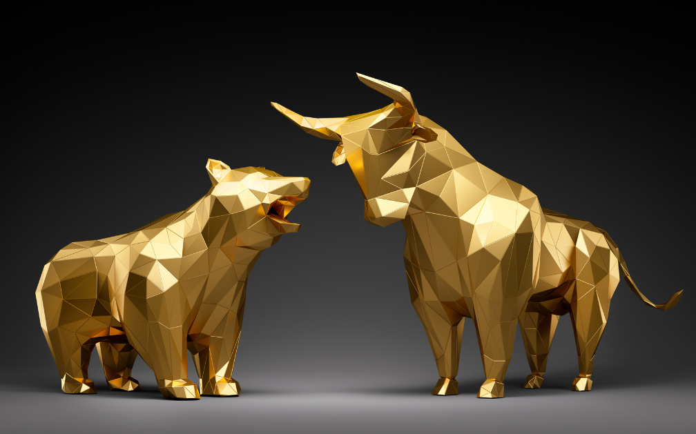 A golden shape of a bear and a golden shape of a bull prepare to fight against a solid black background. The bear has its mouth open and the bull has its horns lowered.